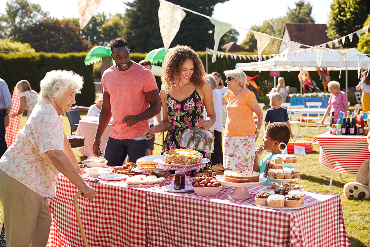 elderly woman visiting a busy bake sale elderly woman visiting a busy bake sale